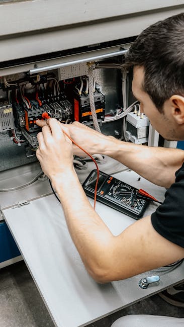 Technician diagnosing electrical panel